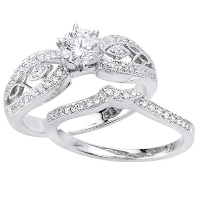 The engagement ring features a round center diamond (0.50 ctw) at the middle 